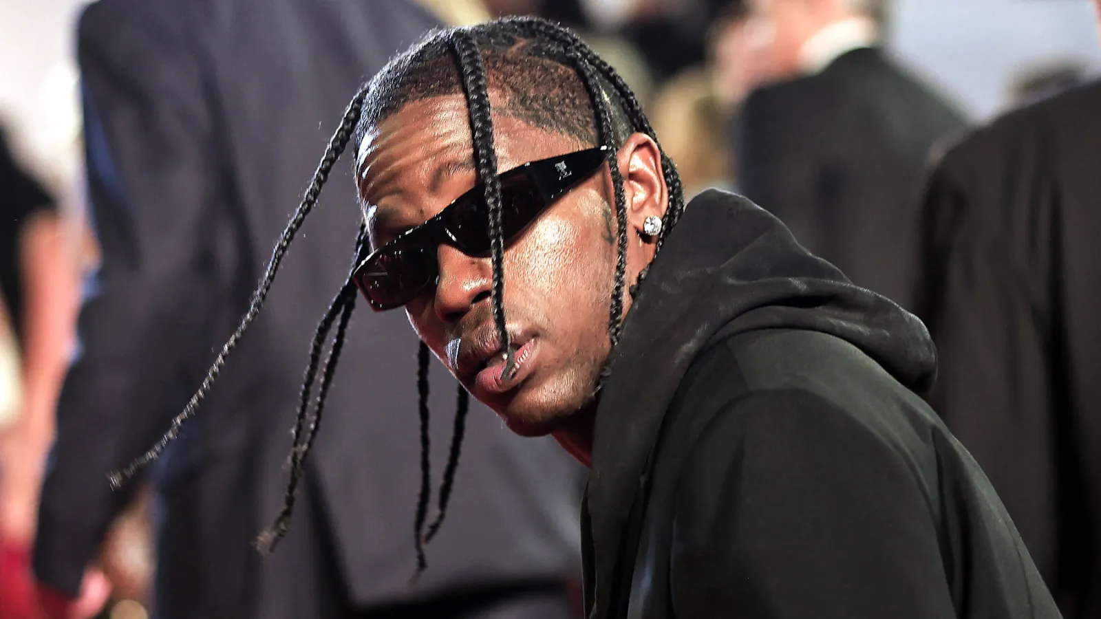 Caught on Camera: Travis Scott Stumbles into Police Car in Paris After Hotel Fight